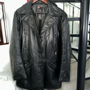 Diesel black genuine leather jacket, large size, 36” long. Mint condition.
